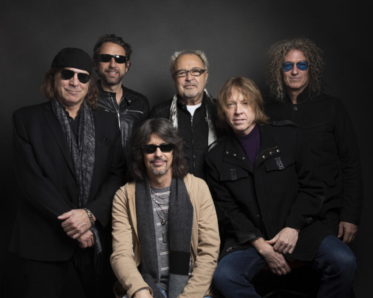 FILE - Thom Gimbel, from left, Michael Bluestein, Mick Jones, Kelly Hansen, Jeff Pilson and Bruce Watson of Foreigner pose for a portrait  during the Sundance Film Festival in Park City, Utah on Jan. 20, 2017.