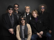 FILE - Thom Gimbel, from left, Michael Bluestein, Mick Jones, Kelly Hansen, Jeff Pilson and Bruce Watson of Foreigner pose for a portrait  during the Sundance Film Festival in Park City, Utah on Jan. 20, 2017.