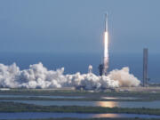 A SpaceX Falcon Heavy rocket with a NASA spacecraft bound for Jupiter lifts off from pad 39A at the Kennedy Space Center Monday, Oct. 14, 2024 in Cape Canaveral, Fla.