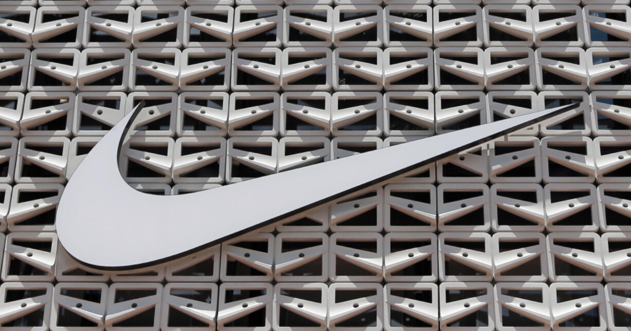 File - The Nike logo is shown on a store in Miami Beach, Fla. on Aug. 8, 2017.