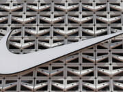 File - The Nike logo is shown on a store in Miami Beach, Fla. on Aug. 8, 2017.