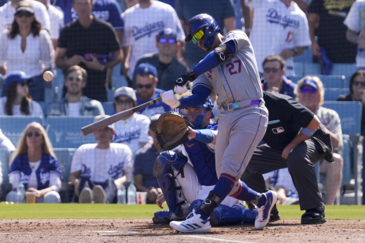 New York Mets&#039; Mark Vientos connects for a grand slam home run against the Los Angeles Dodgers during the second inning in Game 2 of a baseball NL Championship Series, Monday, Oct. 14, 2024, in Los Angeles. (AP Photo/Mark J.