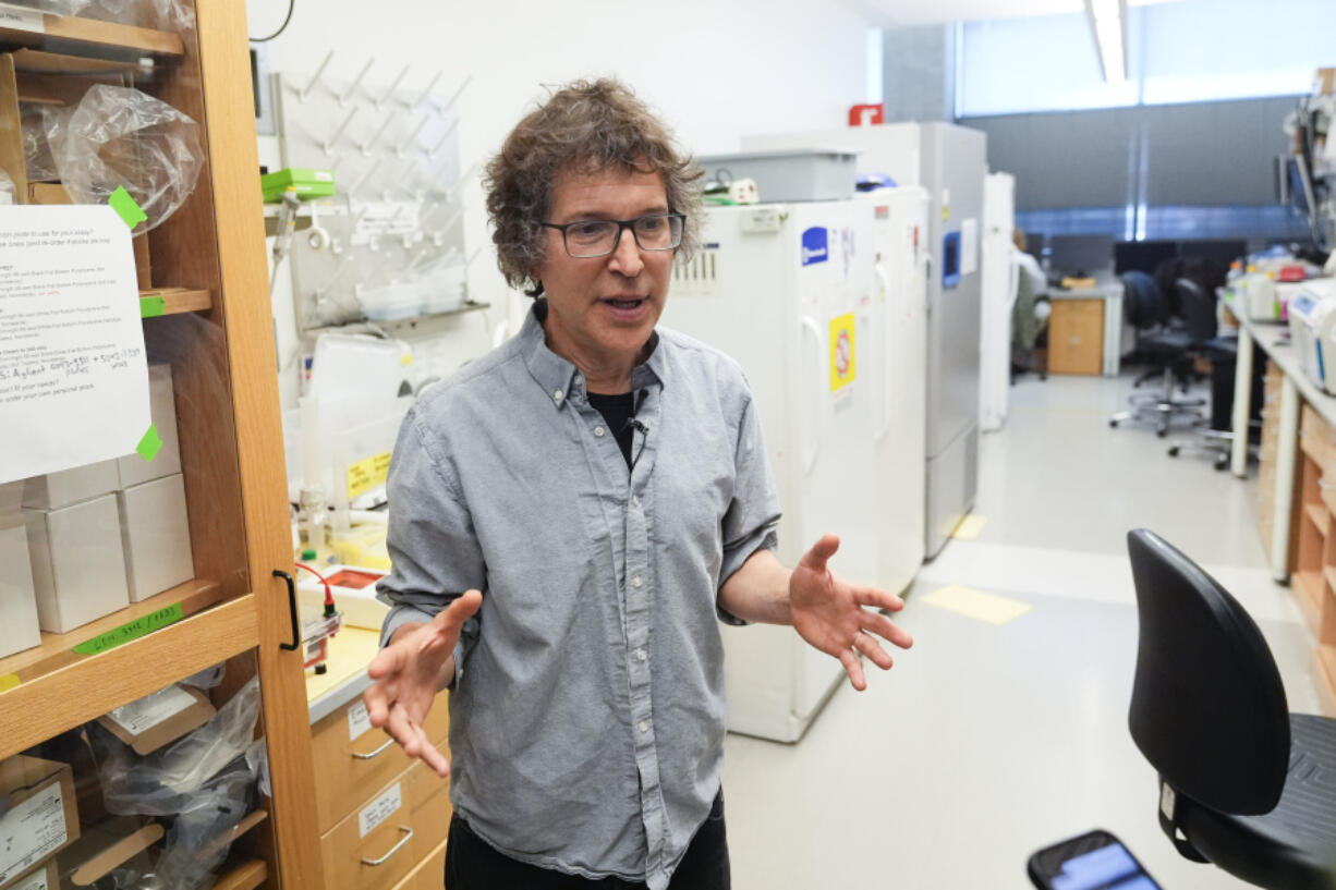 American biochemist David Baker, 2024 Nobel Prize winner in Chemistry, speaks to members of the media during a tour of a lab at the University of Washington on Wednesday, Oct. 9, 2024, in Seattle.