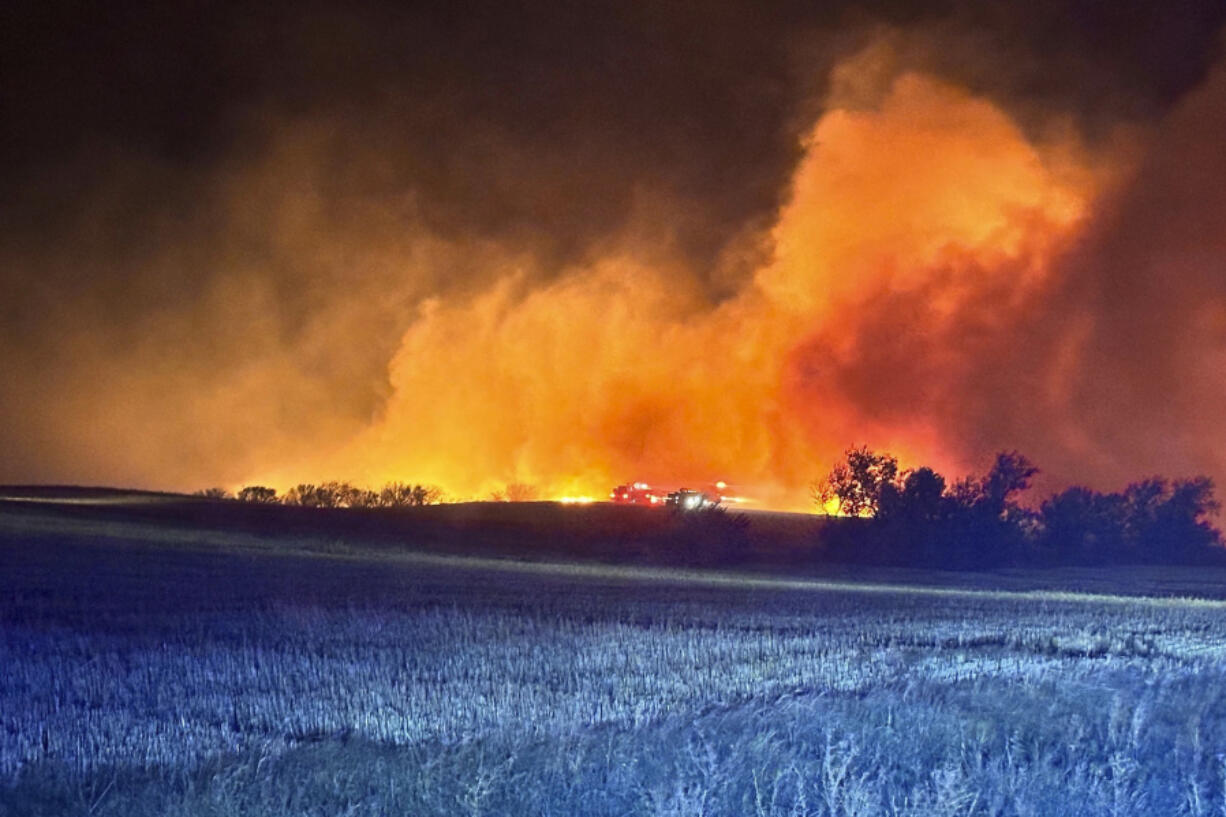 In this photo provided by the Arnegard Fire Protection District, a wildfire burn near Arnegard, N.D., Saturday, Oct. 5, 2024.