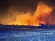 In this photo provided by the Arnegard Fire Protection District, a wildfire burn near Arnegard, N.D., Saturday, Oct. 5, 2024.