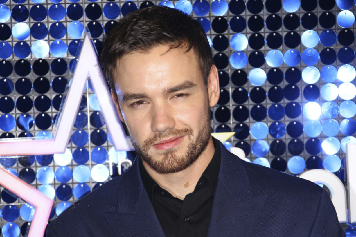 FILE - Singer Liam Payne poses for photographers upon arrival at the Global Gift Gala in London, March 7, 2019.