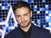 FILE - Singer Liam Payne poses for photographers upon arrival at the Global Gift Gala in London, March 7, 2019.