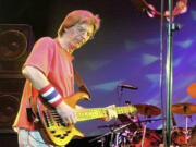 FILE - Phil Lesh, of The Grateful Dead, performs during a reunion concert in East Troy, Wis. on Aug. 3, 2002. Lesh, a founding member of the Grateful Dead, died Friday, Oct. 25, 2024, at age 84.