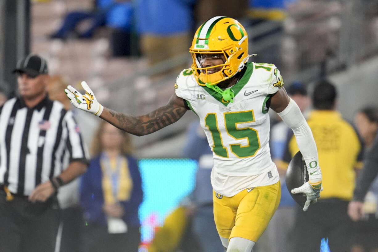 Oregon wide receiver Tez Johnson (15) celebrates after catching a touchdown during the second half of an NCAA college football game against UCLA, Saturday, Sept. 28, 2024, in Pasadena, Calif.