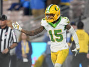 Oregon wide receiver Tez Johnson (15) celebrates after catching a touchdown during the second half of an NCAA college football game against UCLA, Saturday, Sept. 28, 2024, in Pasadena, Calif.