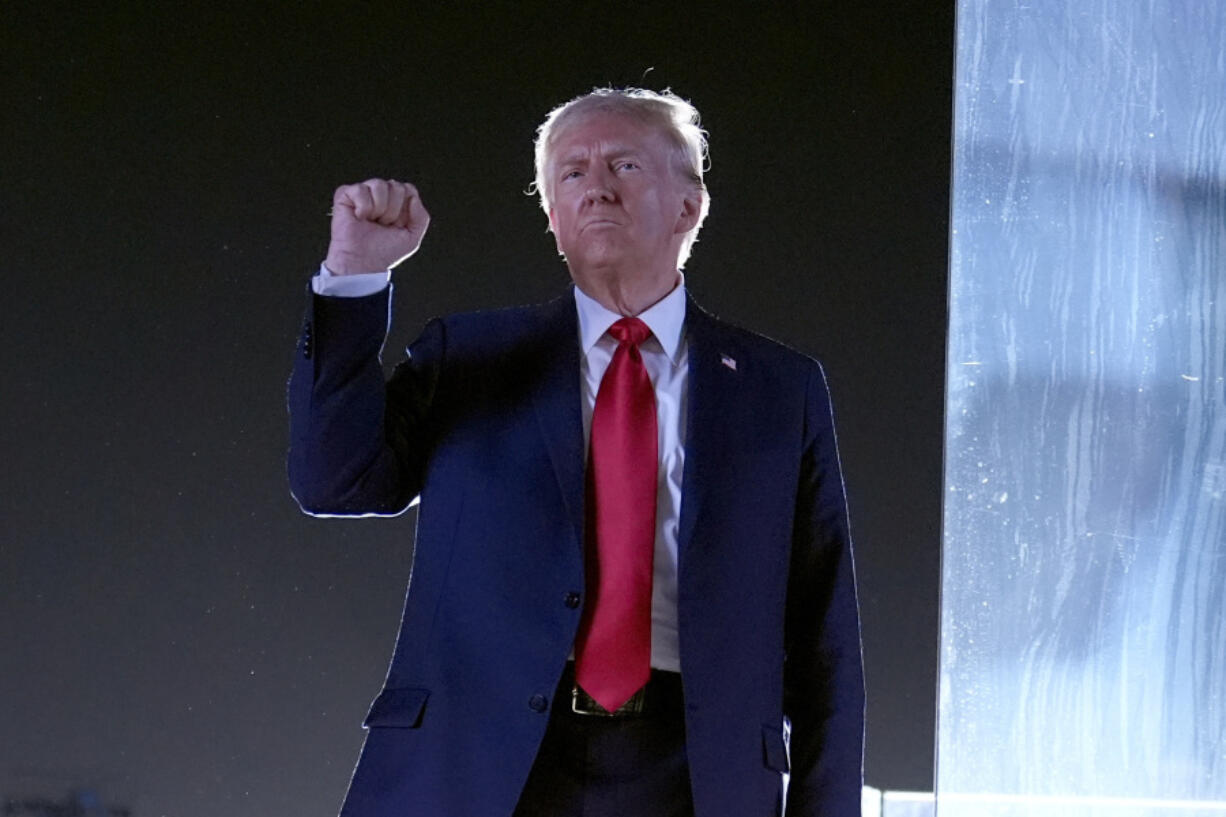 FILE - Republican presidential nominee former President Donald Trump gestures as he concludes speaking at a campaign event at the Butler Farm Show, Saturday, Oct. 5, 2024, in Butler, Pa.