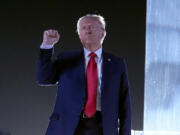 FILE - Republican presidential nominee former President Donald Trump gestures as he concludes speaking at a campaign event at the Butler Farm Show, Saturday, Oct. 5, 2024, in Butler, Pa.