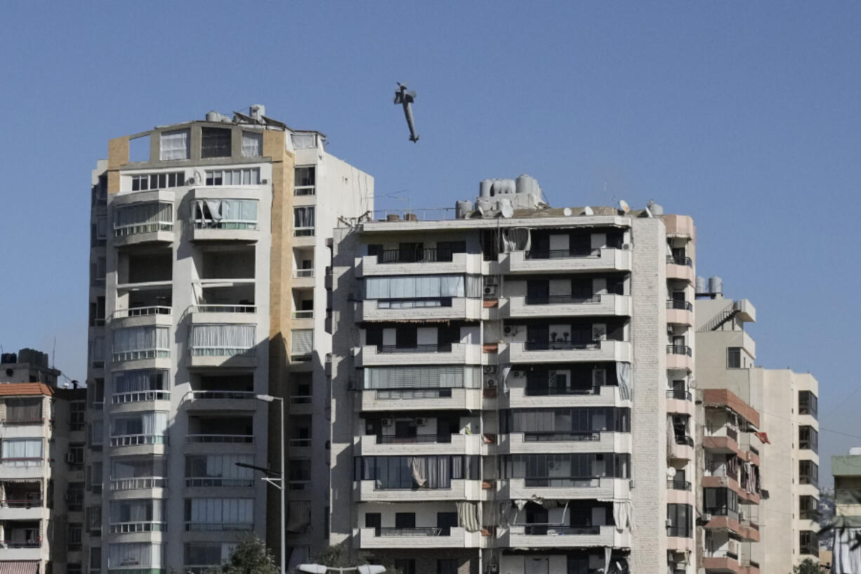 A missile launched from an Israeli jet hits a building in Ghobeiri, Beirut, Lebanon, Tuesday, Oct. 22, 2024.