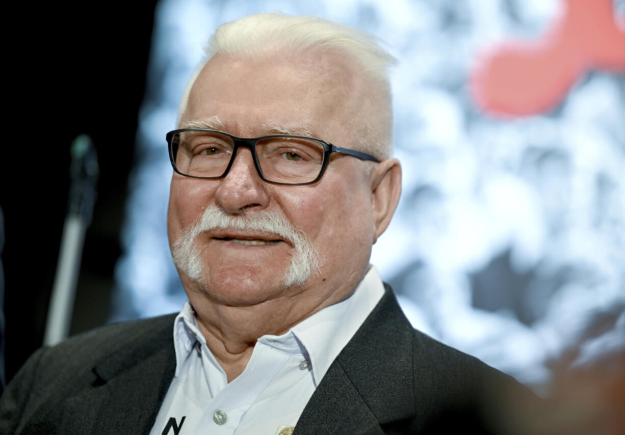 FILE - Lech Walesa former President of Poland, speaks after being awarded withthe &ldquo;Golden Medal for services to reconciliation and understanding among peoples&rdquo; in Berlin, Monday Sept. 26, 2022.