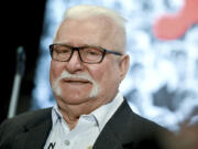 FILE - Lech Walesa former President of Poland, speaks after being awarded withthe &ldquo;Golden Medal for services to reconciliation and understanding among peoples&rdquo; in Berlin, Monday Sept. 26, 2022.