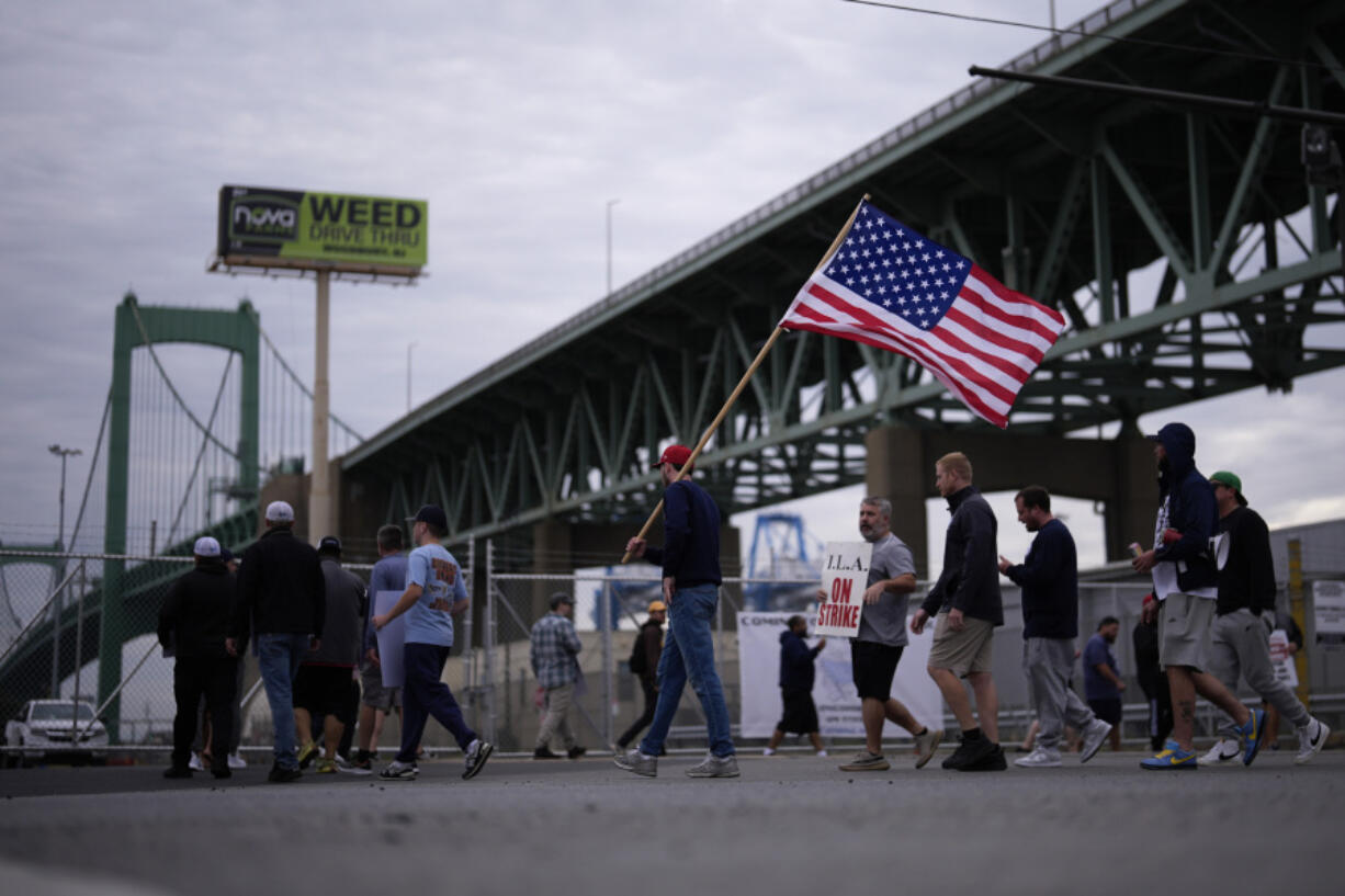 Striking longshoreman picket outside the Packer Avenue Marine Terminal Port, Tuesday, Oct. 1, 2024, in Philadelphia.