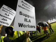 Hundreds of longshoremen strike together outside of the Virginia International Gateway in Portsmouth, Va., Tuesday, Oct. 1, 2024.