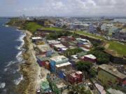 FILE - An aerial view of the seaside neighborhood of La Perla, in San Juan, Puerto Rico, is seen on Aug. 25, 2017.