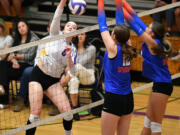 Columbia River sophomore Sophia Gourley (8) spikes the ball Wednesday, Oct. 9, 2024, during the Rapids’ 3-2 win against Ridgefield at Columbia River High School.