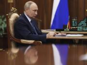 Russian President Vladimir Putin speaks with Head of Federal Customs Service Valery Pikalyov at the Kremlin in Moscow, Russia, Friday, Oct. 25, 2024.