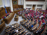 In this photo provided by the Press Service Of The President Of Ukraine on Oct. 16, 2024, Ukraine&rsquo;s President Volodymyr Zelenskyy speaks to parliamentarians at Verkhovna Rada in Kyiv, Ukraine.