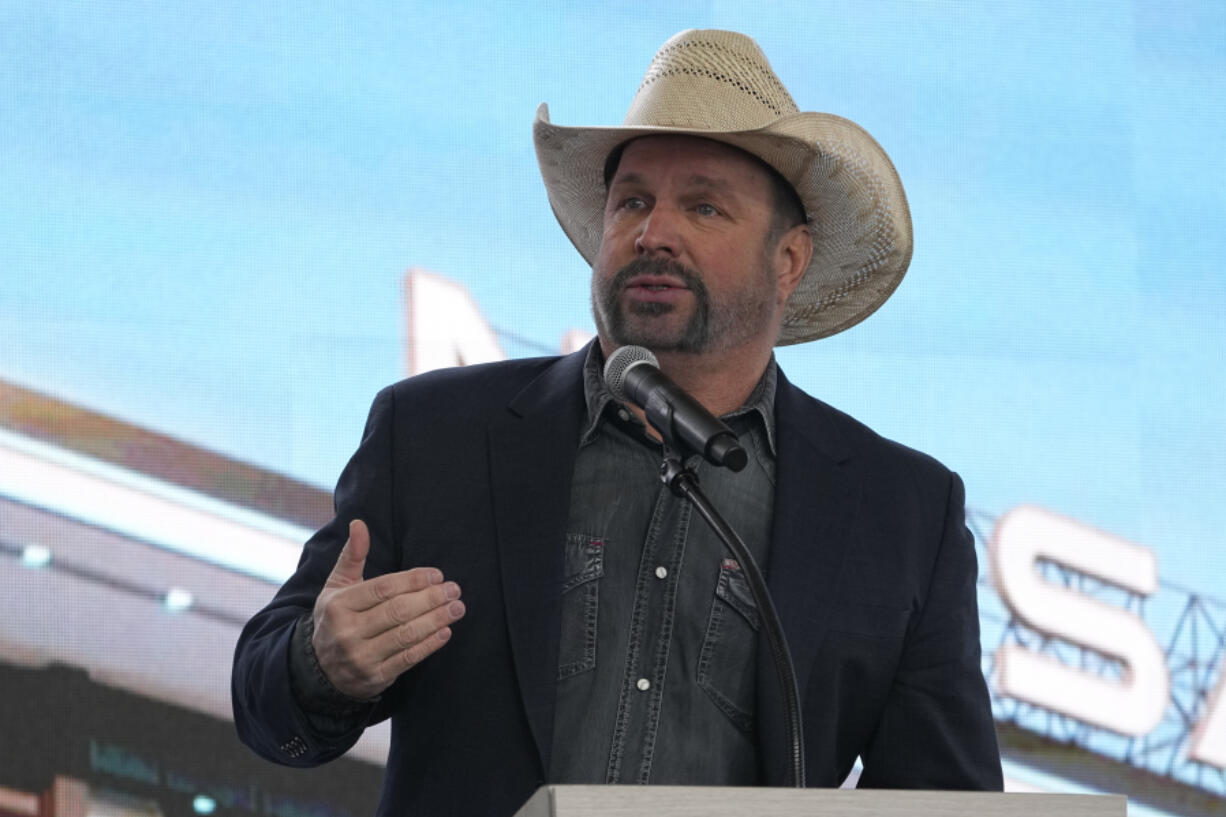 FILE - Garth Brooks speaks during a groundbreaking ceremony for the Tennessee Titans new NFL football stadium, Feb. 29, 2024, in Nashville, Tenn.