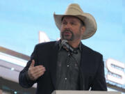 FILE - Garth Brooks speaks during a groundbreaking ceremony for the Tennessee Titans new NFL football stadium, Feb. 29, 2024, in Nashville, Tenn.