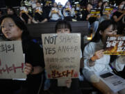 Citizens stage a rally against deepfake sex crime in Seoul, South Korea, Friday, Sept. 27, 2024.