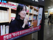 A TV screen shows an image of the winner of the 2024 Nobel Prize in Literature, South Korean writer Han Kang, during a news program at Seoul Railway Station in Seoul, South Korea, Thursday, Oct. 10, 2024.