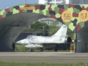 In this image taken from video, a Taiwanese air force French made Mirage-2000 fighter jet prepares for take off from the Hsinchu air base in Taiwan on Monday, Nov. 14, 2024.