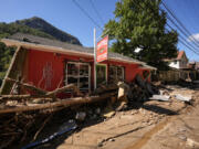 Businesses are seen in a debris field in the aftermath of Hurricane Helene, Wednesday, Oct. 2, 2024, in Chimney Rock Village, N.C.