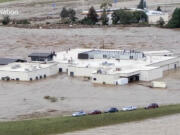 In this image made from a video provided by NewsNation, people can be seen on the roof of the Unicoi County Hospital in Erwin, Tenn., on Friday, Sept. 27, 2024.