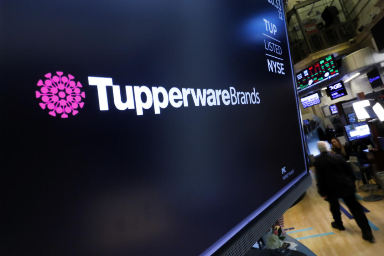 FILE - The logo for Tupperware Brands appears above a trading post on the floor of the New York Stock Exchange on Oct. 30, 2019.