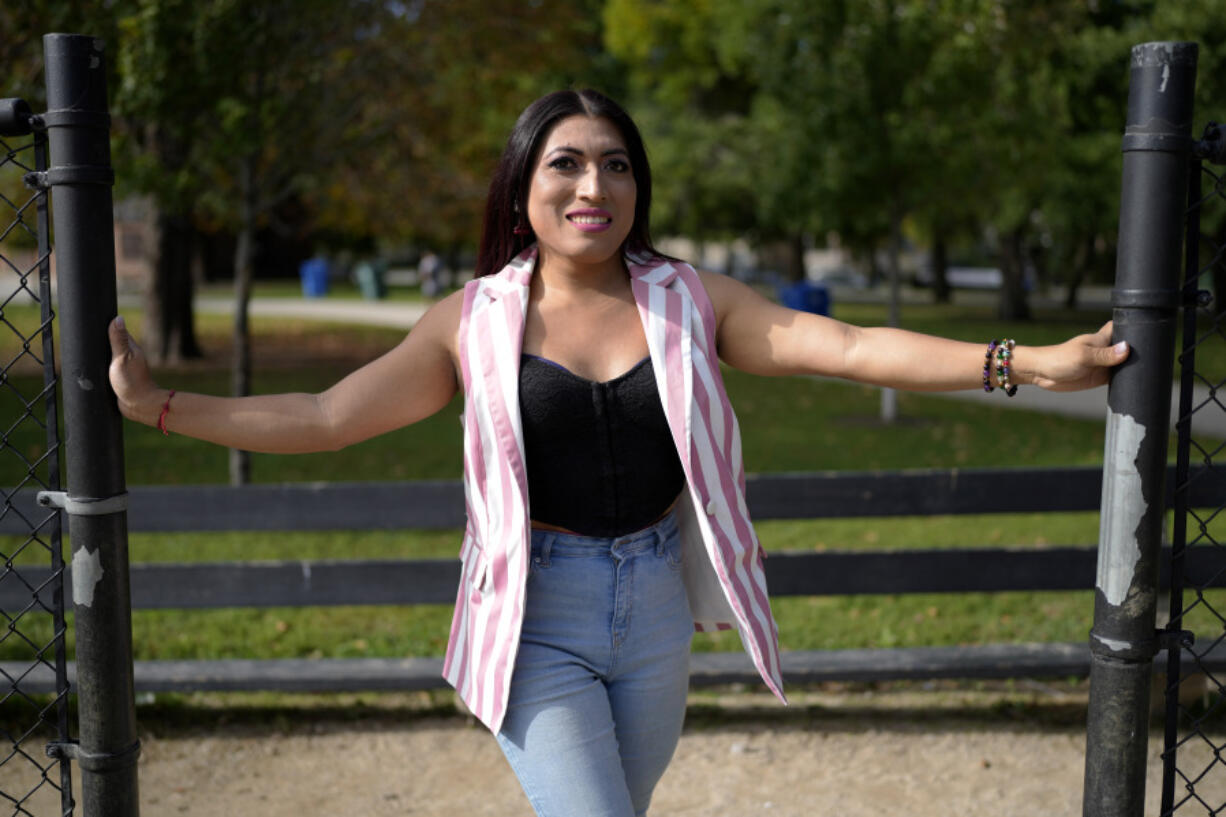 Julieth Luna Garcia, a transgender woman from El Salvador, poses for photos at Horner Park in Chicago, Monday, Sept. 30, 2024. (AP Photo/Nam Y.