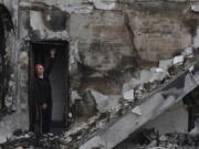 FILE - Valentina, 53, a local woman, stands inside the Evangelical Christian Baptists prayer house in Orihiv, Ukraine, on Monday, May 22, 2023, which was destroyed the previous day by a Russian attack.