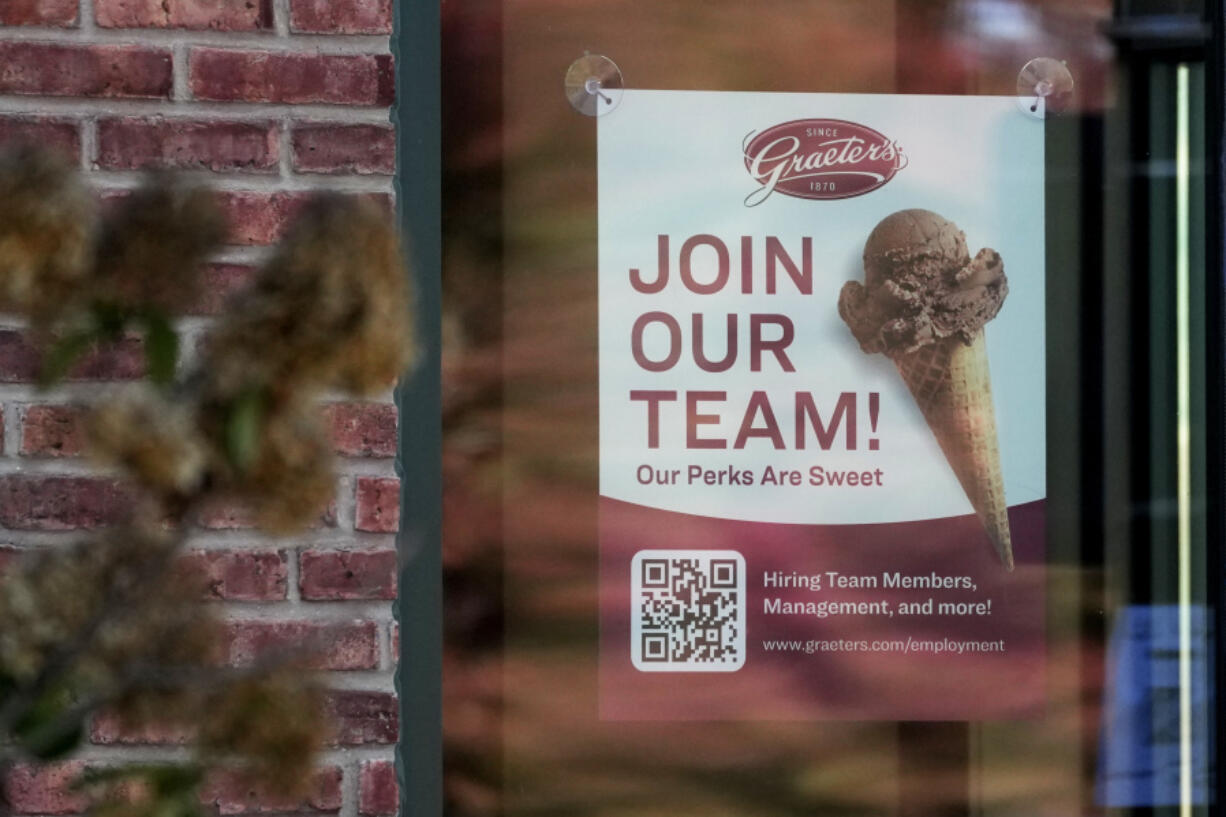 A sign soliciting job applicants is displayed at an ice cream shop in Northbrook, Ill., Sunday, Oct. 27, 2024. (AP Photo/Nam Y.