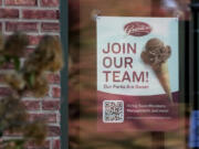 A sign soliciting job applicants is displayed at an ice cream shop in Northbrook, Ill., Sunday, Oct. 27, 2024. (AP Photo/Nam Y.