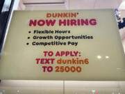 A hiring sign is displayed at a Dunkin&rsquo; in Glenview, Ill., Tuesday, October. 1, 2024. (AP Photo/Nam Y.