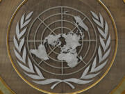 FILE - The United Nations logo is seen inside the 79th session of the United Nations General Assembly, Tuesday, Sept. 24, 2024.