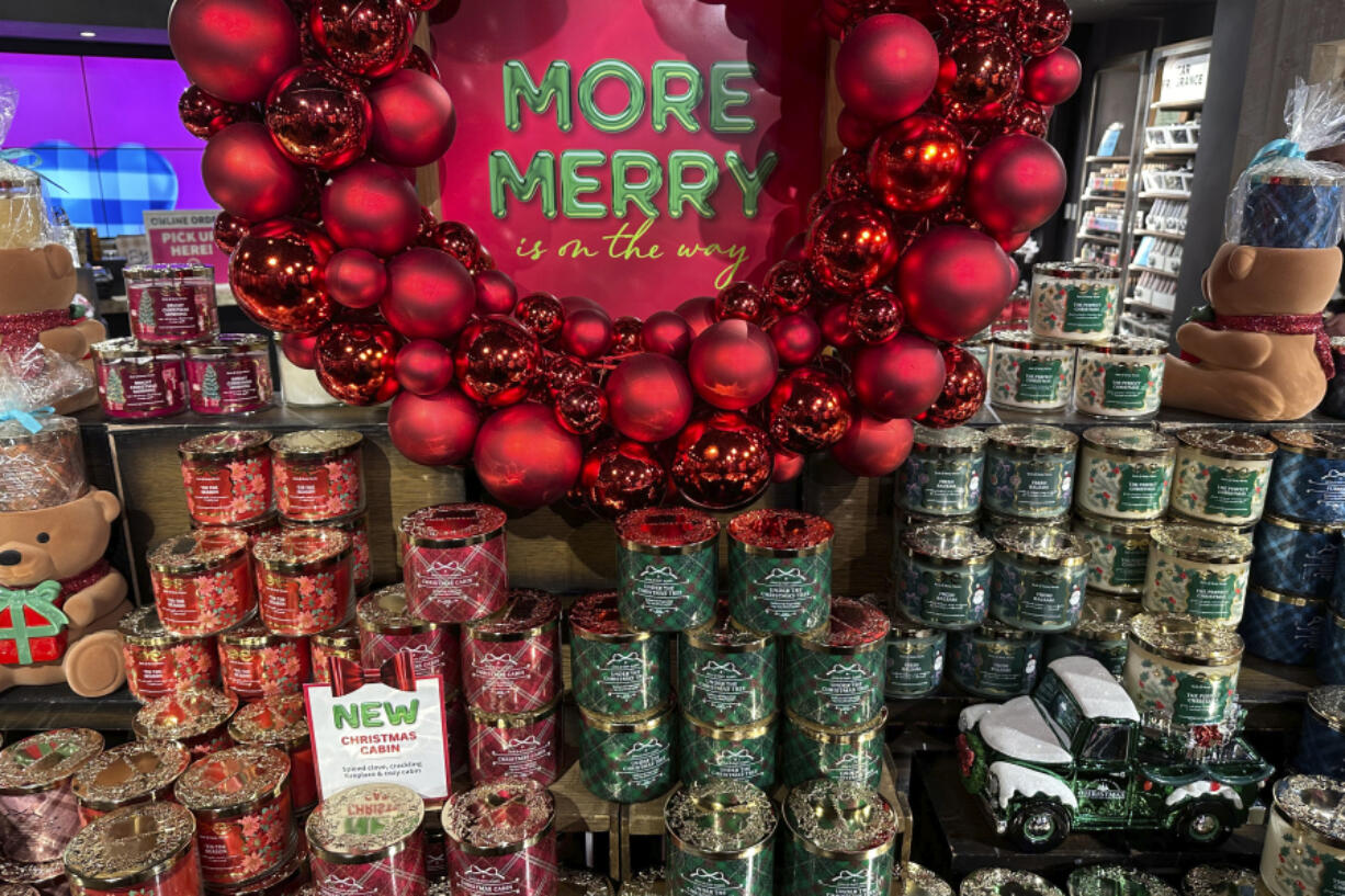 An arrangement of holiday themed scented candles is shown at a Bath and Body Works store on Wednesday in New York.