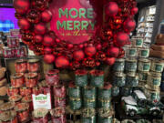 An arrangement of holiday themed scented candles is shown at a Bath and Body Works store on Wednesday in New York.