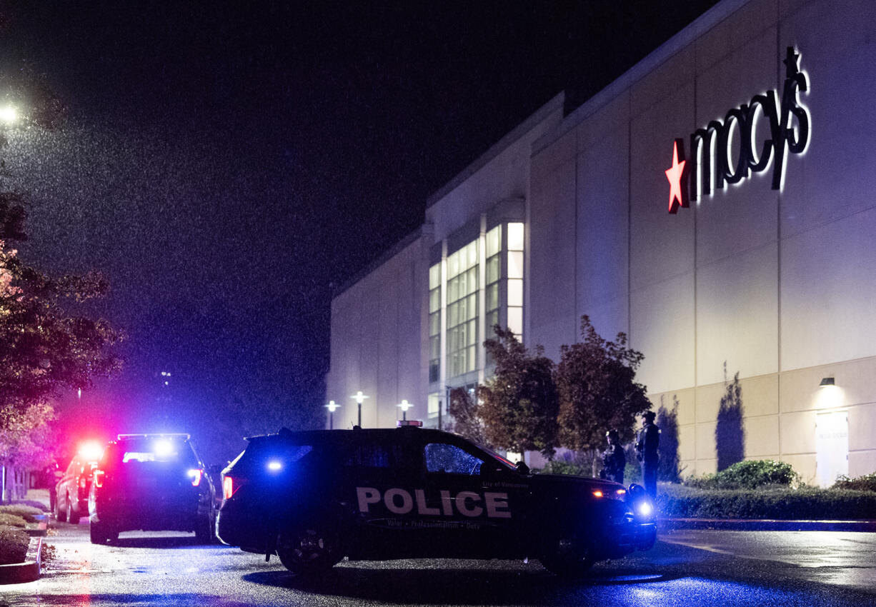 Police vehicles sit outside Macy’s at the Vancouver Mall on Thursday, Oct. 31, 2024, after a shooting.