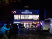 Police lights illuminate the food court entrance to Vancouver Mall after a shooting on Thursday, Oct. 31, 2024.