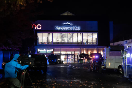 Police lights illuminate the food court entrance to Vancouver Mall after a shooting on Thursday, Oct. 31, 2024.