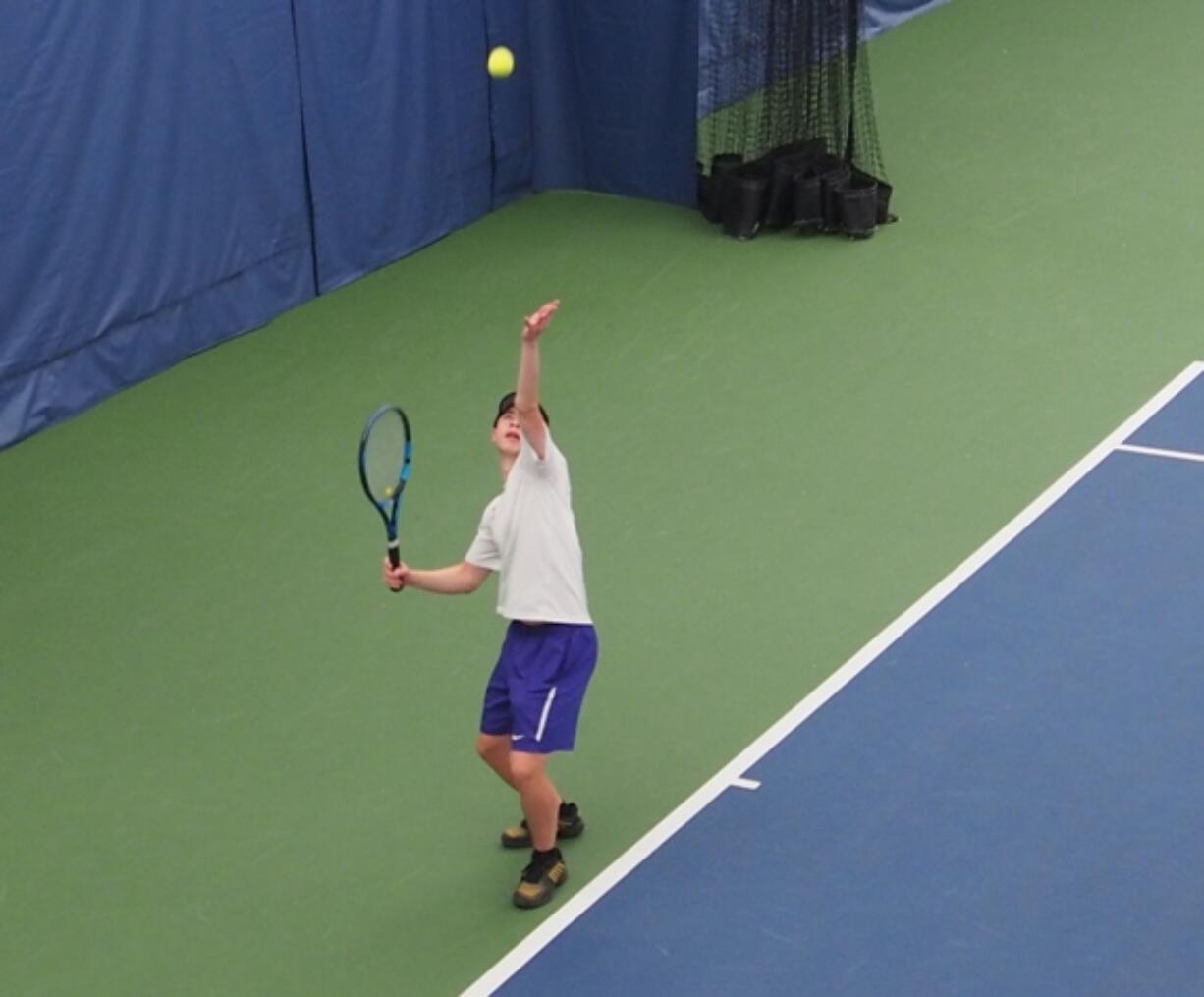 Lucas Walburn of Columbia River serves during the championship match of the 2A District 4 boys tennis tournament on Friday, Oct. 25, 2024, at Vancouver Tennis Center. The junior was his fourth title in a row.