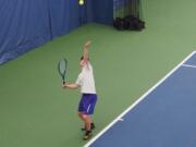 Lucas Walburn of Columbia River serves during the championship match of the 2A District 4 boys tennis tournament on Friday, Oct. 25, 2024, at Vancouver Tennis Center. The junior was his third title in a row.