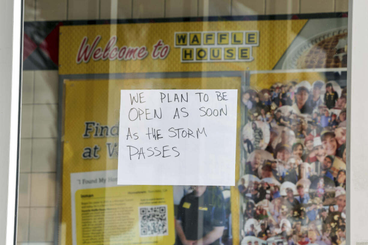 A sign on a closed Waffle House on Highway US 19 in anticipation of Hurricane Milton on Tuesday, Oct. 8, 2024, in New Port Richey, Fla.