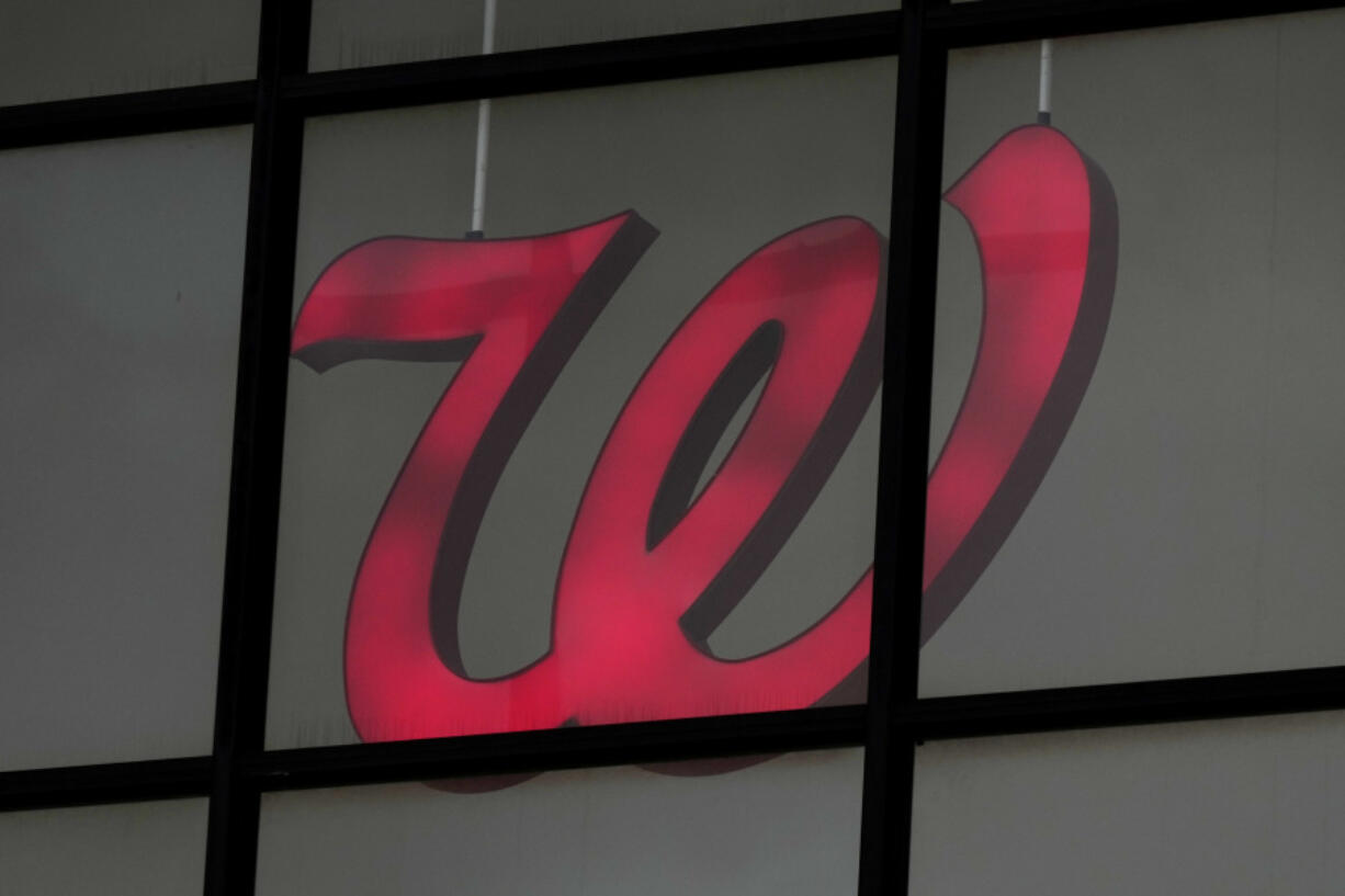 A Walgreens logo is seen from the exterior of a store in Wheeling, Ill., Tuesday, Oct. 15, 2024. (AP Photo/Nam Y.