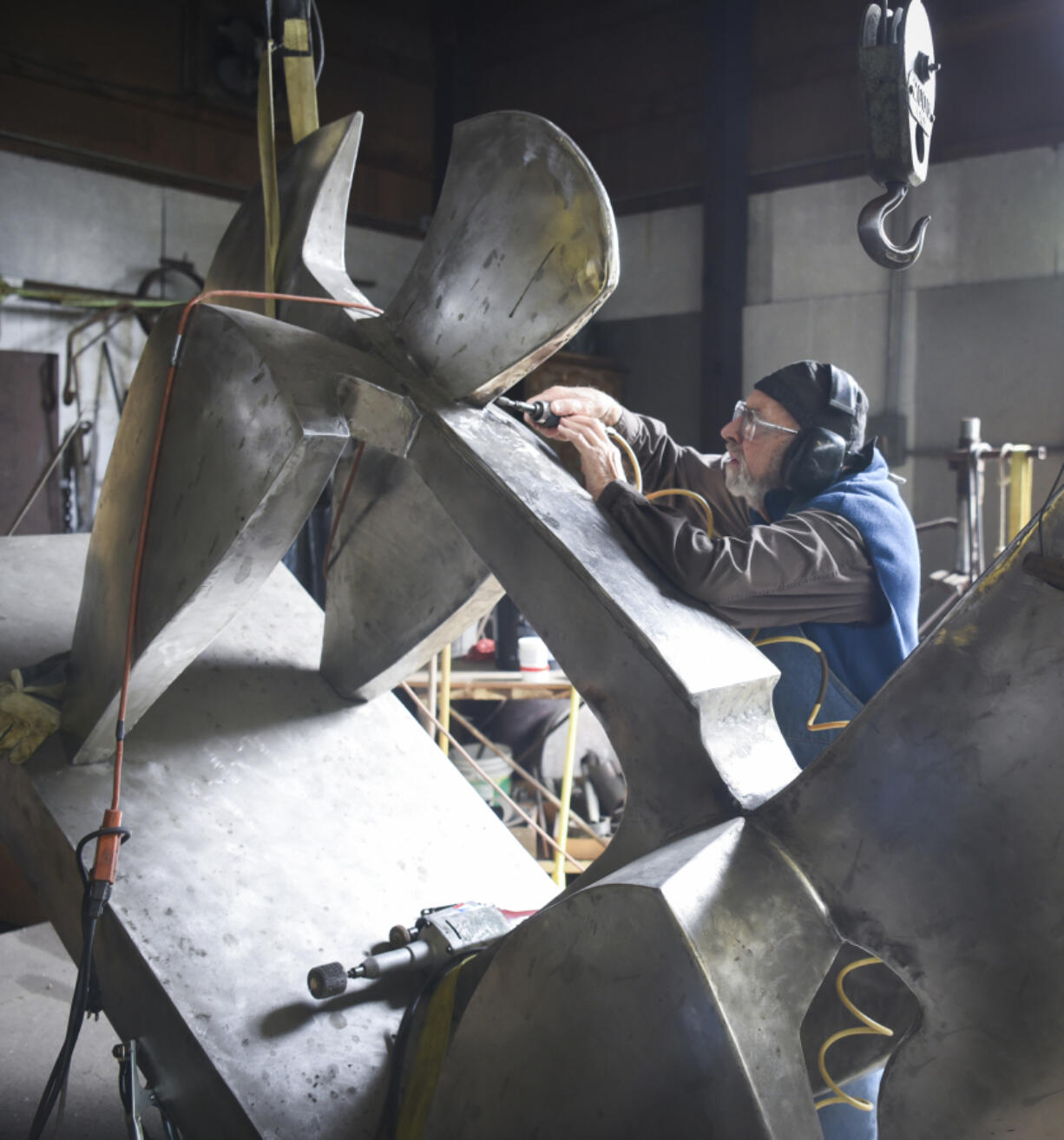 Sculptor James Lee Hansen works on a sculpture called &ldquo;The Sky Skipper&rdquo; in 2017 at his home studio near Daybreak Park.