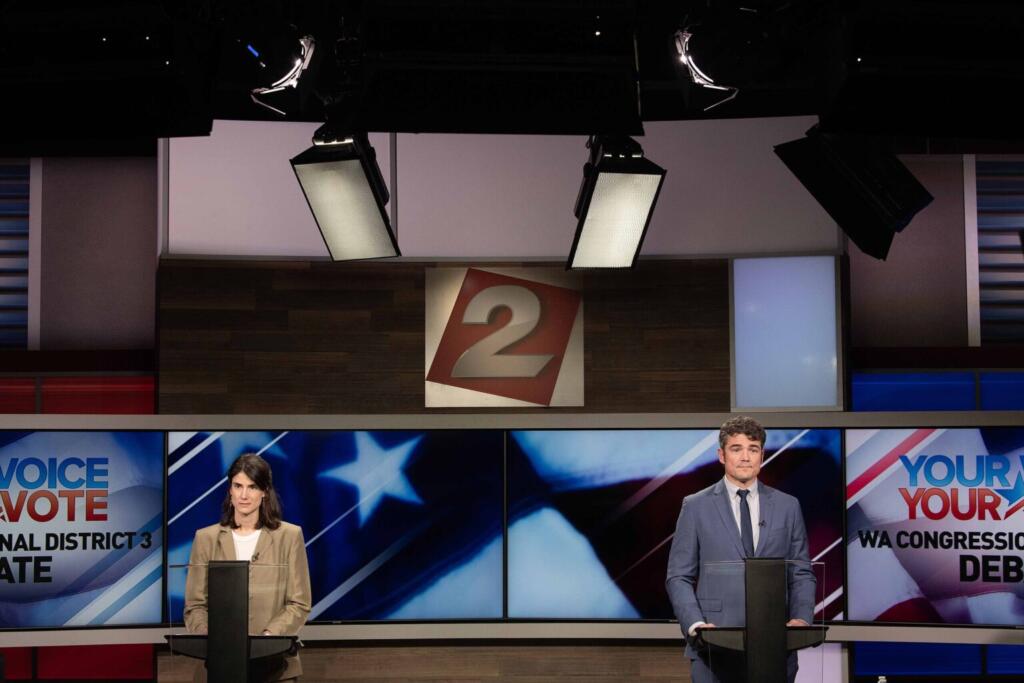 U.S. Rep. Marie Gluesenkamp Perez, from left, debates the issues with challenger Joe Kent at KATU studios in Portland on Monday night, Oct. 7, 2024.